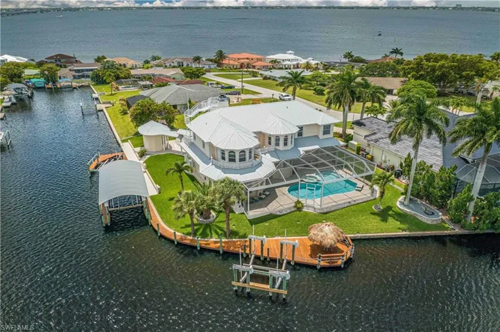 Birds eye view of property featuring a residential view and a water view