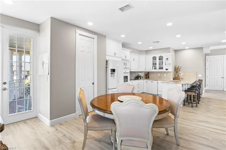 Dining area featuring recessed lighting, light wood-type flooring, and baseboards
