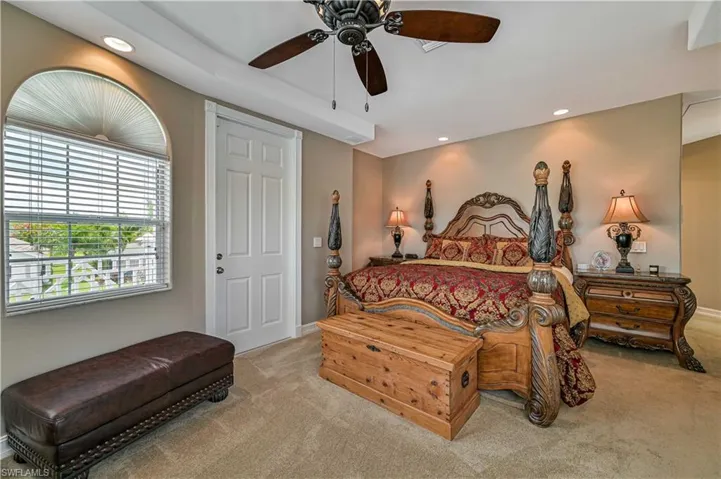 Bedroom featuring recessed lighting, ceiling fan, and carpet floors