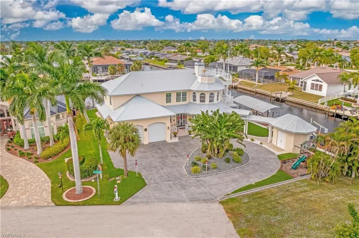 Aerial view of residential area featuring a large body of water