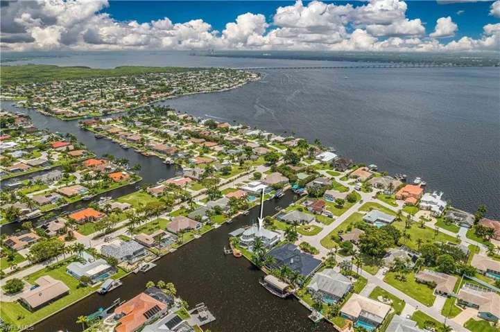 Aerial view featuring a residential view and a water view
