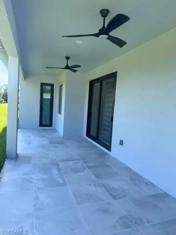 View of patio featuring ceiling fan