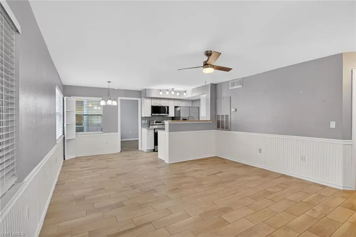 Unfurnished bedroom with light wood-type flooring and ceiling fan