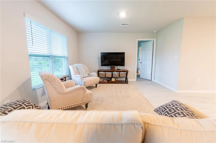 Living room with light wood-type flooring