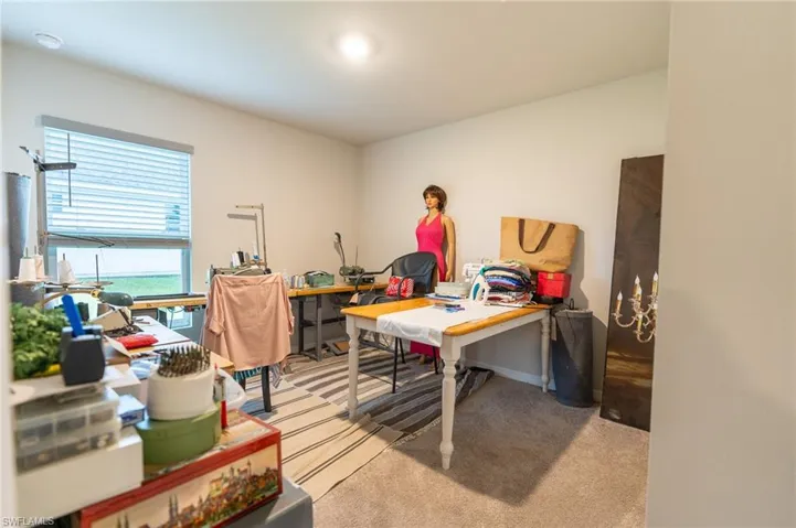 Office space featuring light carpet