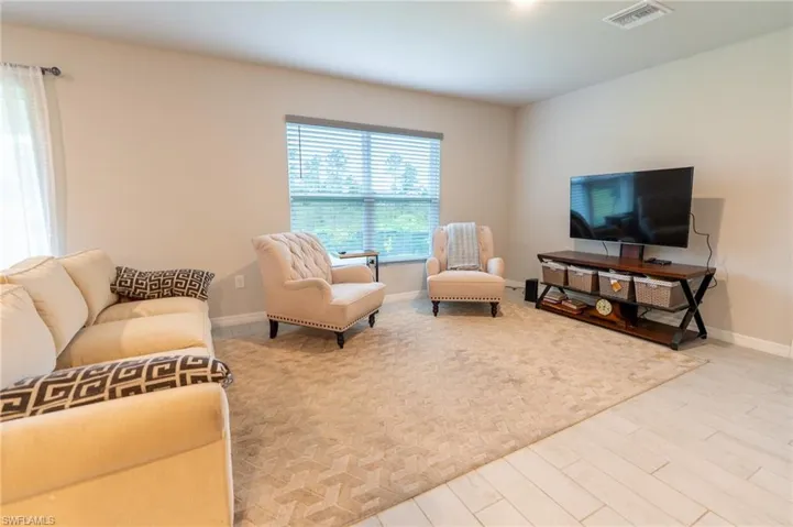 Living room with light hardwood / wood-style floors