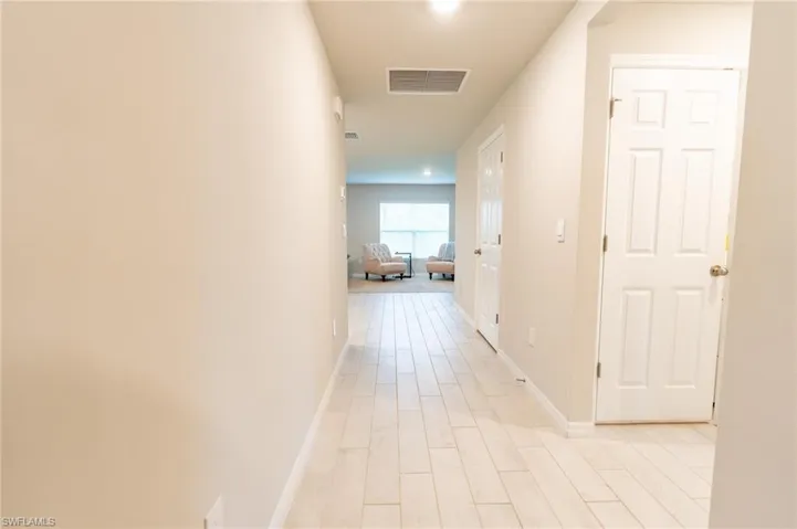 Hall featuring light hardwood / wood-style flooring