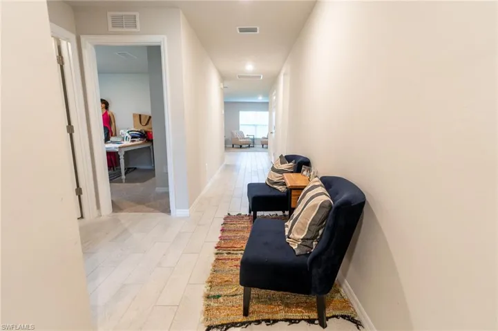 Corridor featuring light hardwood / wood-style floors