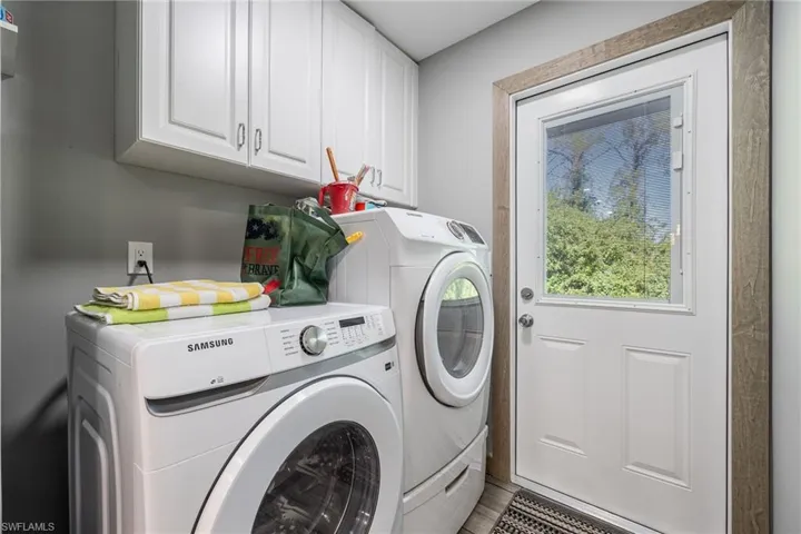 Laundry area with washer and dryer and cabinet space