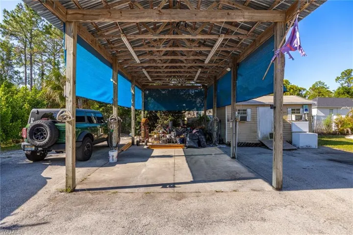 View of patio / terrace with a detached carport and an outdoor structure