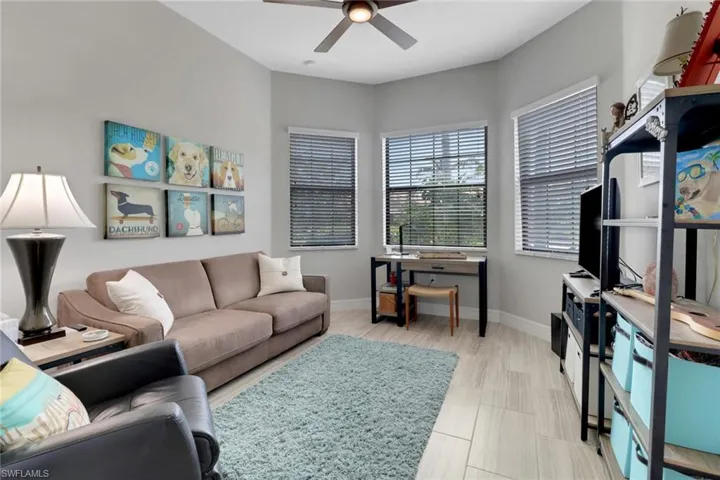 Bedroom 2 serves as a craft room with a sleeper sofa - overlooks the front yard