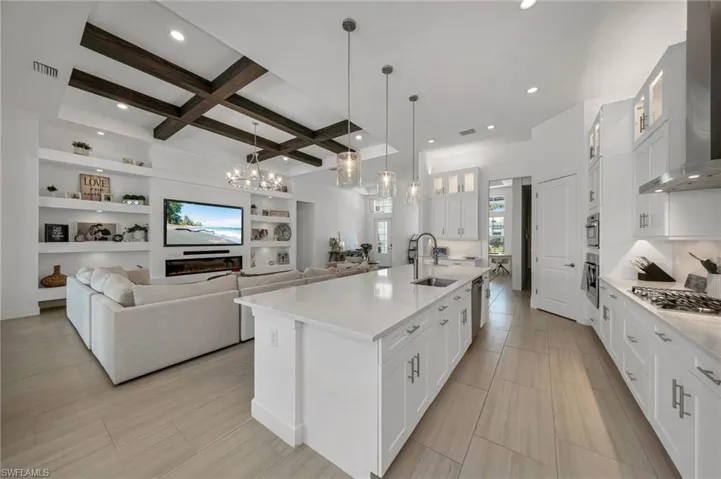 Kitchen with extended cabinetry overlooking living room