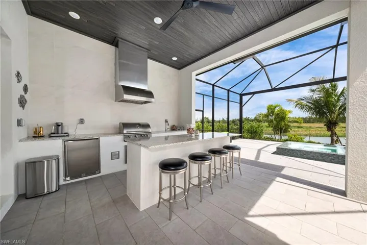 Outdoor kitchen with custom bar