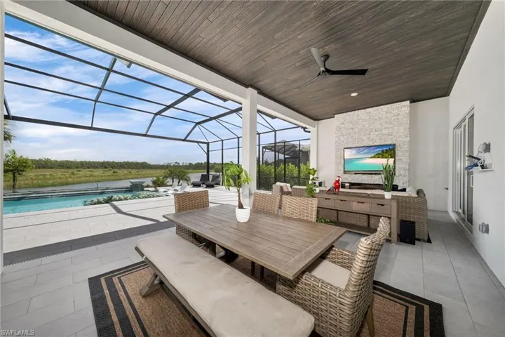 Lanai living area with walled off custom entertainment built-in