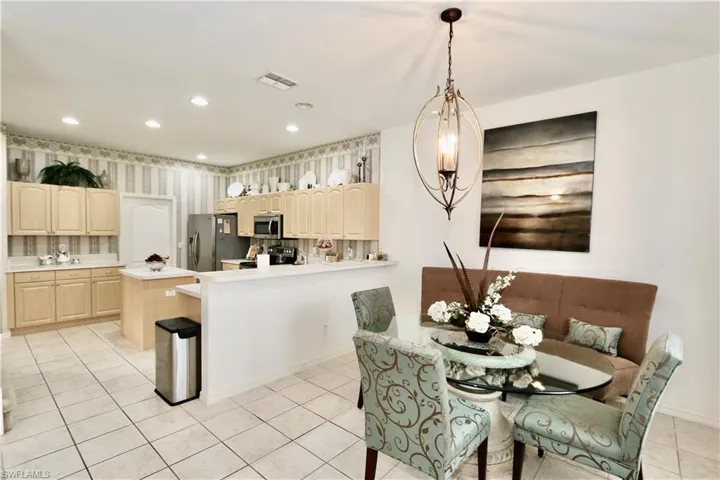 Dining space featuring light tile floors