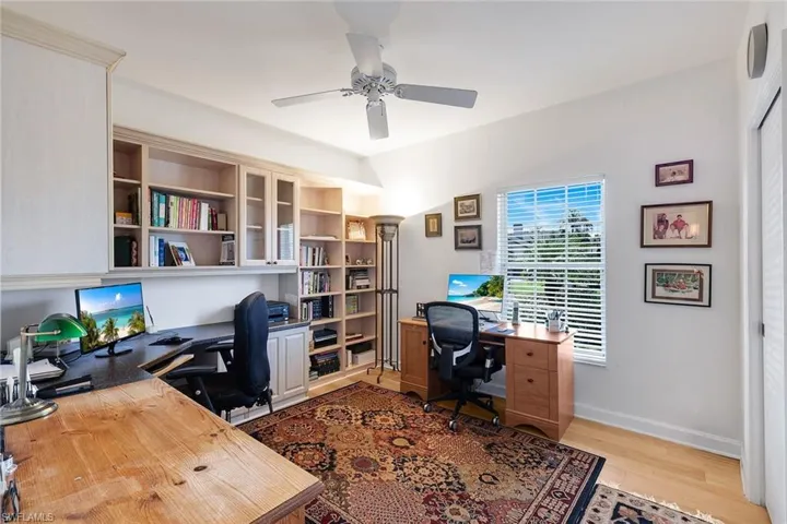 4th Bedroom- 11'x12' Used As An Office, Built In Bookcases, and Desk Wood Flooring, Sunny Window, Room for a Full Size Pull Out or Murphy Bed. 2 other desks shown are not built in