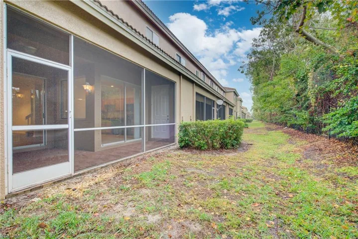 View of yard with a sunroom