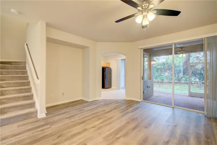 Unfurnished living room featuring light hardwood / wood-style floors and ceiling fan