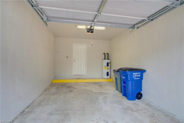 Garage with a garage door opener and water heater