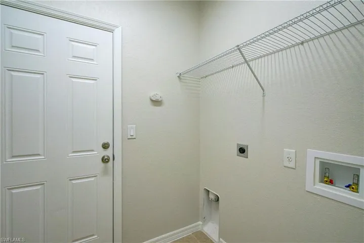 Laundry area with hookup for a washing machine and electric dryer hookup