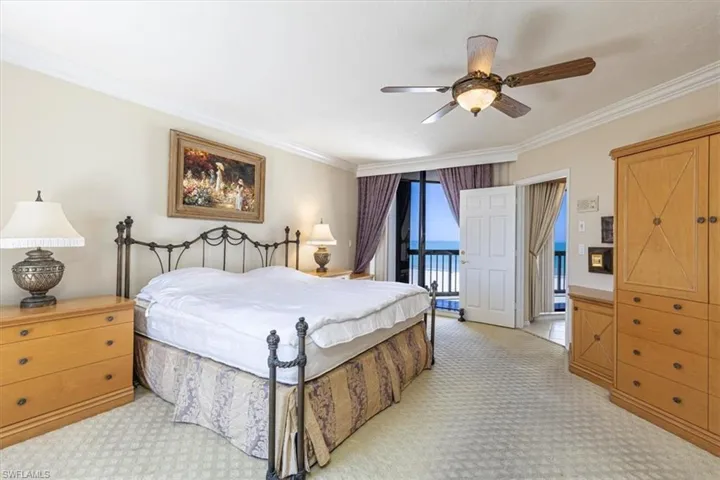 Bedroom with crown molding, access to exterior, a ceiling fan, and light colored carpet