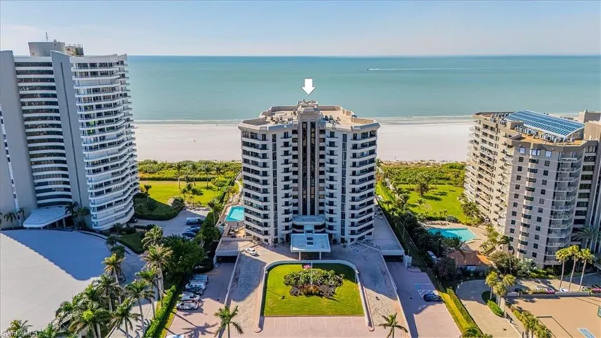 Aerial view of apartment complex / building and expansive beach