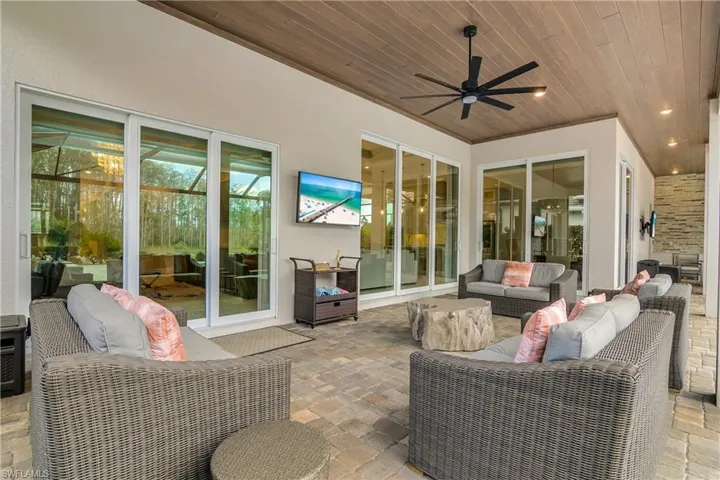 View of patio featuring an outdoor hangout area and ceiling fan