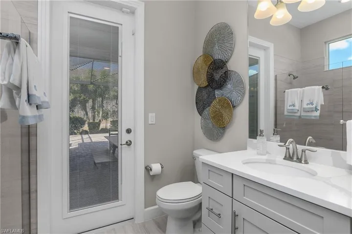 Bathroom with a tile shower and vanity