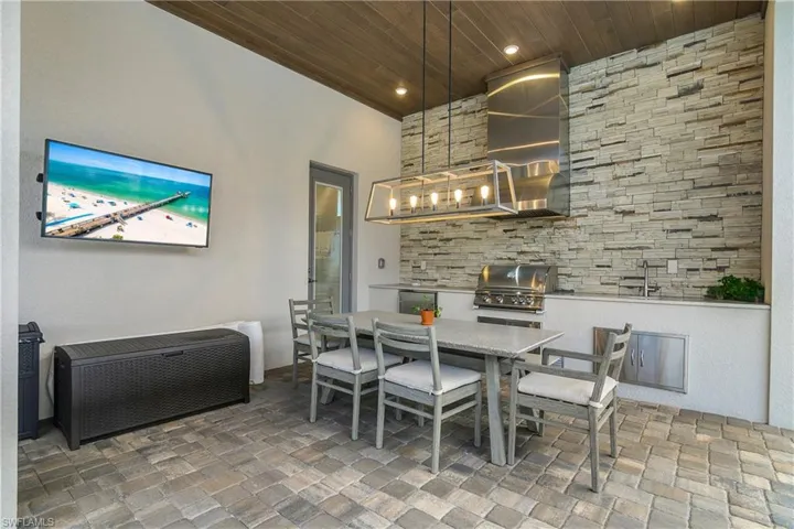 Dining room with wood ceiling and recessed lighting