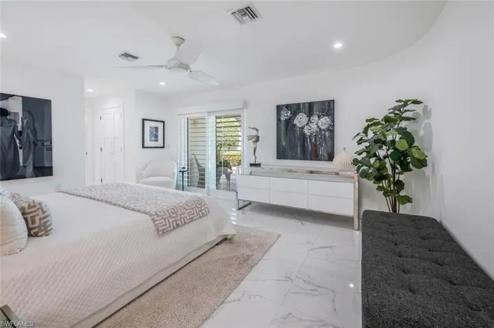 Bedroom featuring ceiling fan and access to exterior