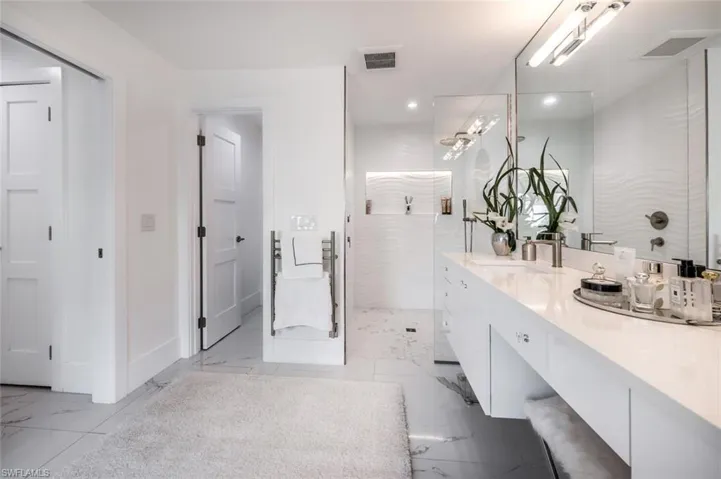 Bathroom featuring a shower and vanity