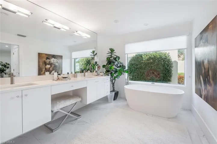 Bathroom with vanity and a bathtub