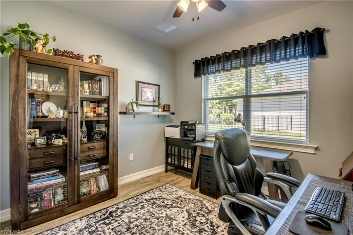 Office area featuring ceiling fan and light hardwood / wood-style flooring
