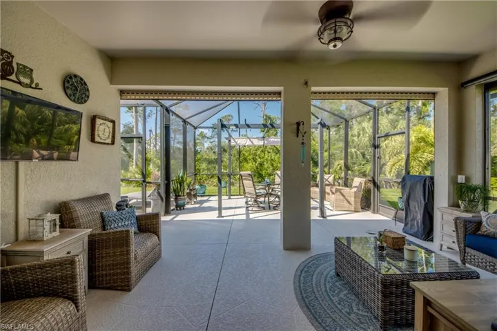 Sunroom featuring ceiling fan