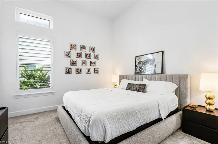 Bedroom with carpet floors and baseboards