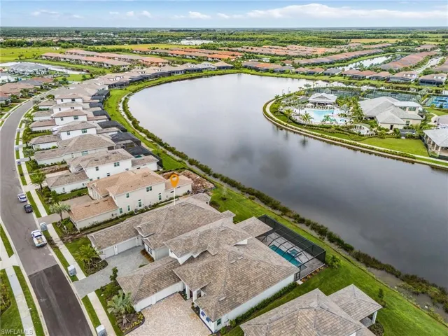 Aerial view of residential area featuring a large body of water