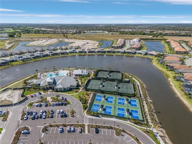 Aerial overview of property's location with a large body of water and nearby suburban area