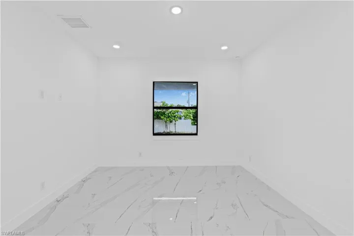 Empty room with recessed lighting