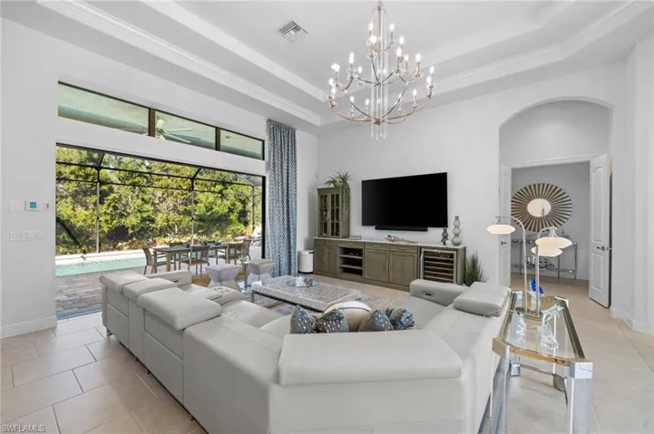 Beautiful open living room with pool and beautiful private backyard views!