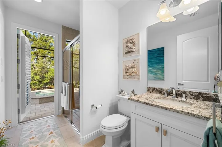 Guest Bathroom #2 / Pool bath with walk-in shower and plantation shutter door treatment!