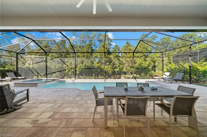 Gorgeous covered outdoor space with ceiling fan and private view!