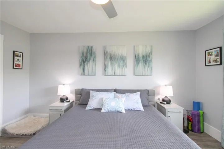 Bedroom featuring ceiling fan and hardwood / wood-style flooring