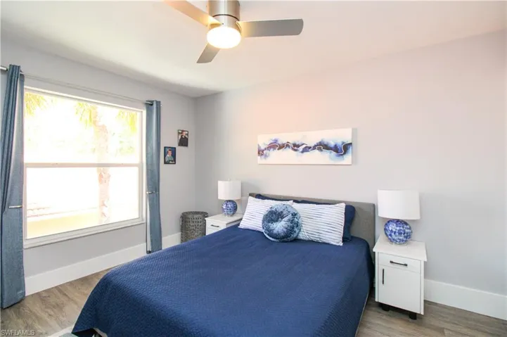 Bedroom featuring hardwood / wood-style floors and ceiling fan