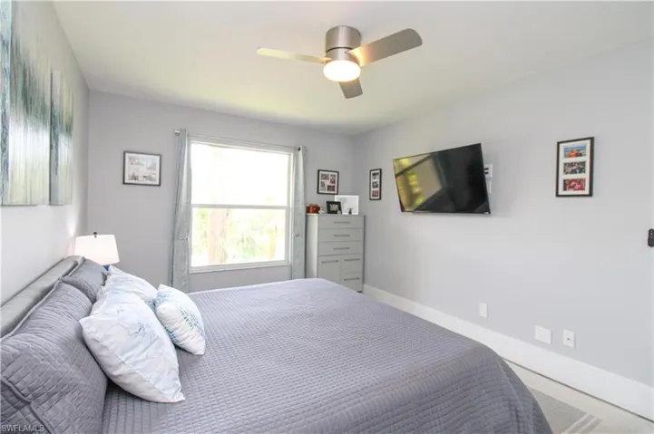 Bedroom featuring carpet and ceiling fan