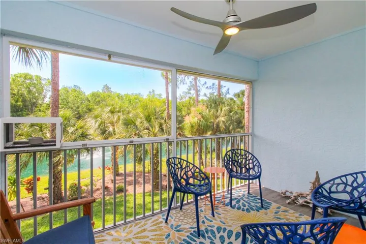 Sunroom / solarium featuring ceiling fan