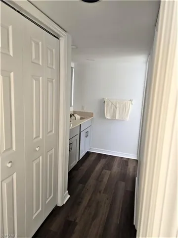 Bathroom with vanity and hardwood / wood-style floors