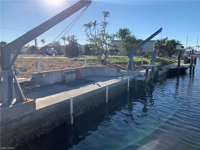 View of concrete dock and davits from the canal.