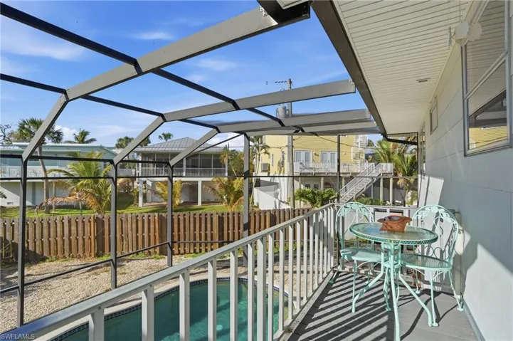 Balcony with view of sparkling pool - Virtually Edited Image