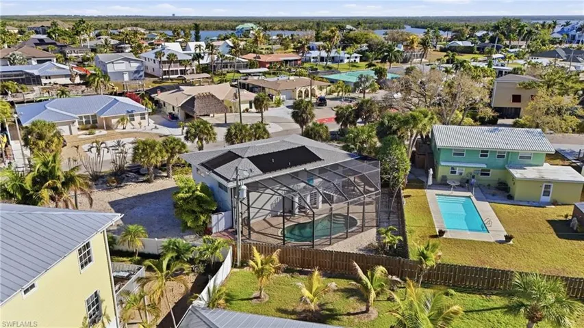 Aerial view of residential area with a pool - Virtually Edited Image