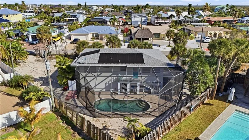 Bird's eye view of a pool and rear of home - Virtually Edited Image